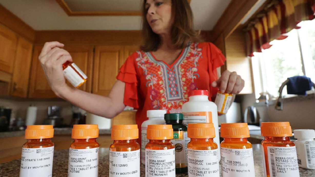 Debra Grant looks over her heart medications at her home
in Salt Lake City on Aug. 8, 2021. A protein that helps regulate calcium
signaling within heart cells could play a key role in preventing
chronic heart failure.