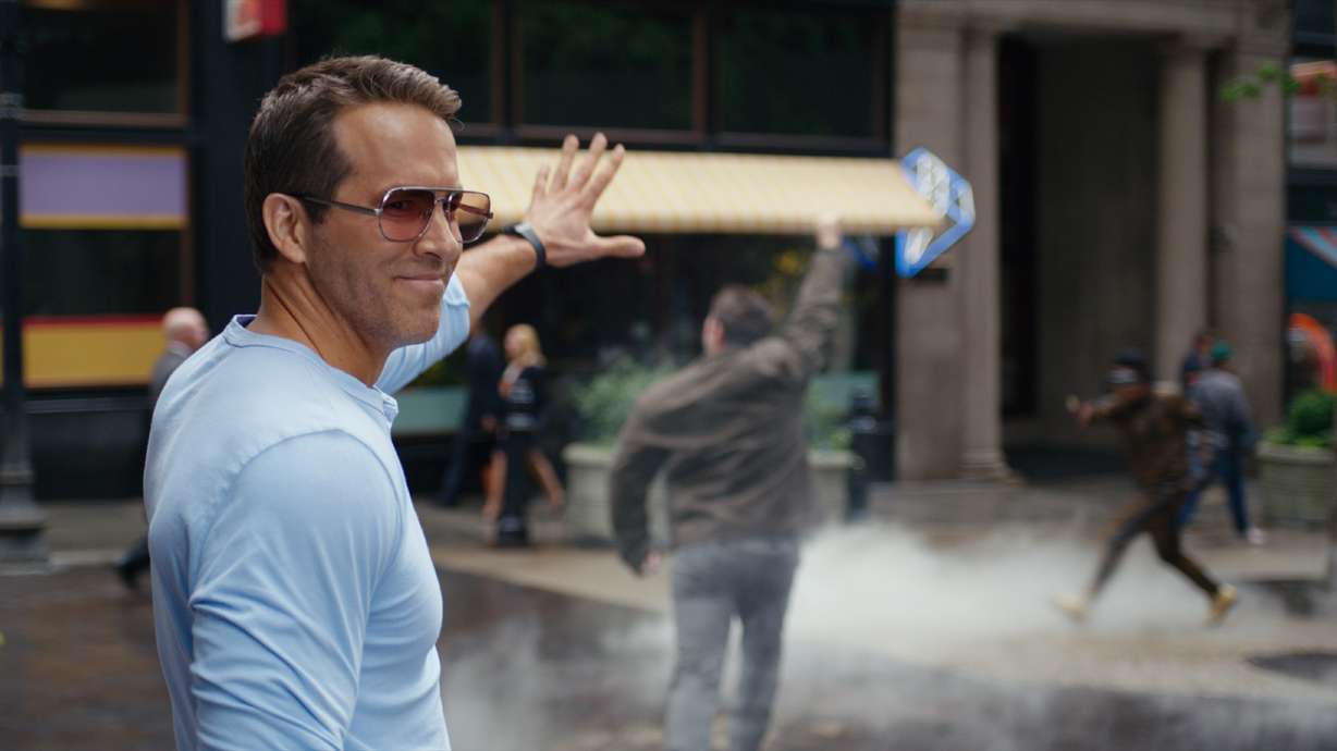 This image released by 20th Century Studios shows Ryan Reynolds in a scene from "Free Guy."