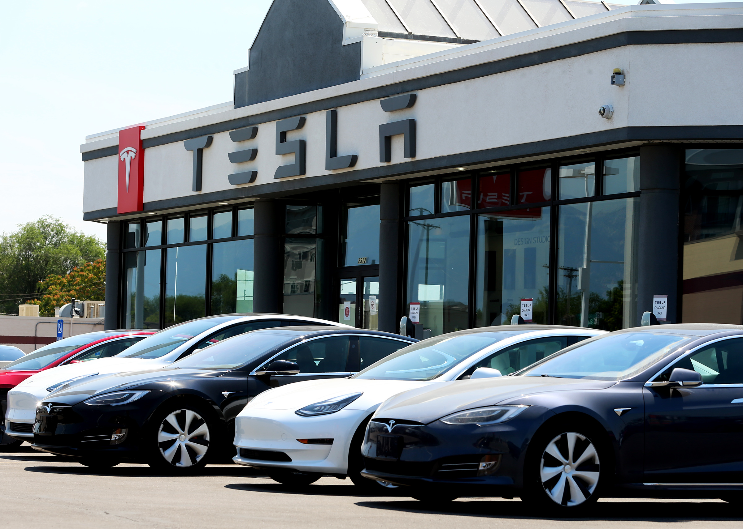 The Tesla dealership in Salt Lake City is pictured on Tuesday, July 21, 2020. U.S. auto safety regulators said Monday they had opened a formal safety probe into Tesla's driver assistance system Autopilot after a series of crashes nationwide involving emergency vehicles.


