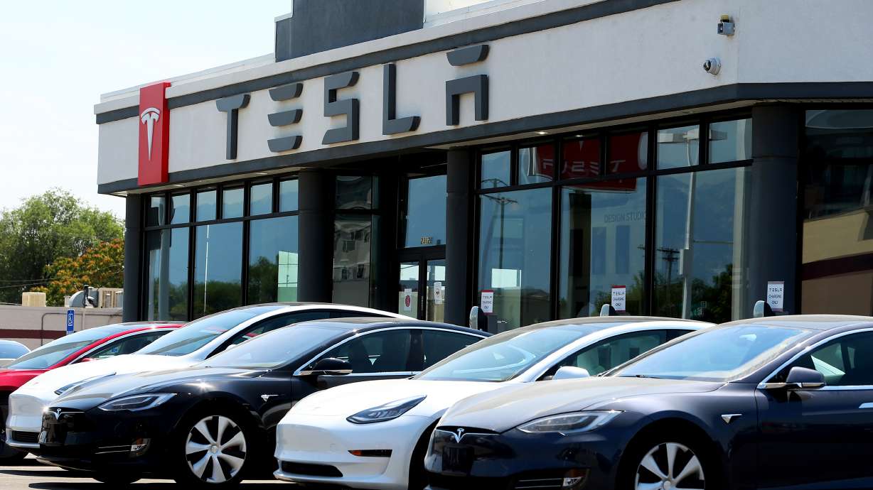 The Tesla dealership in Salt Lake City is pictured on Tuesday, July 21, 2020. U.S. auto safety regulators said Monday they had opened a formal safety probe into Tesla's driver assistance system Autopilot after a series of crashes nationwide involving emergency vehicles.
