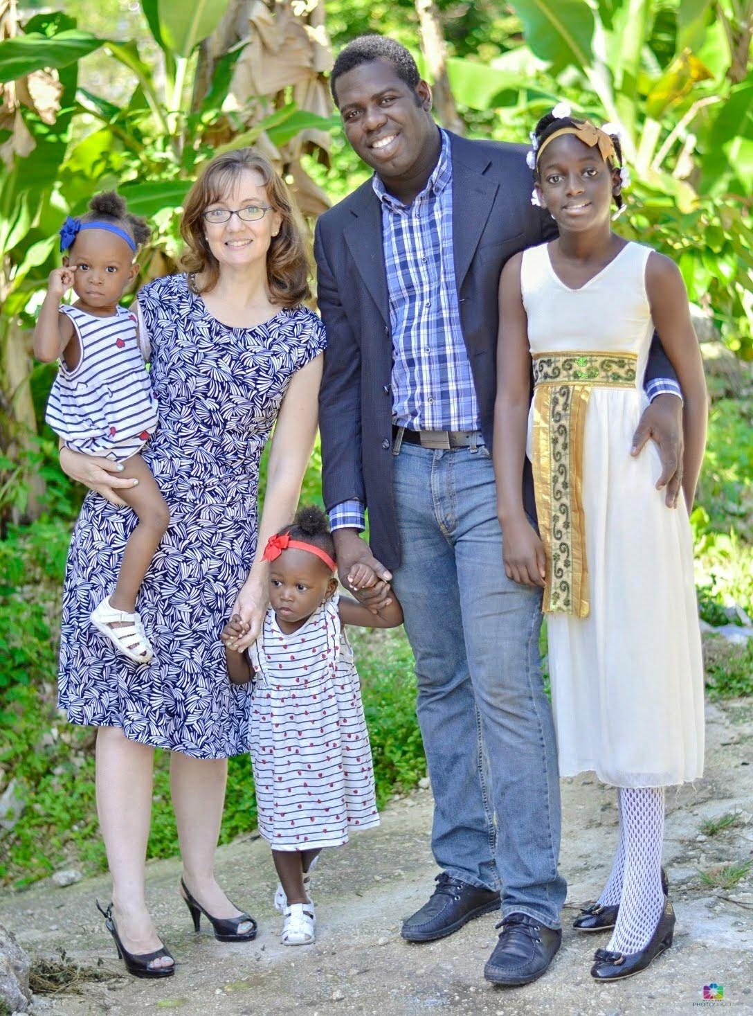 Erika Charles, a Utah native, is pictured in Haiti with her three children and husband.