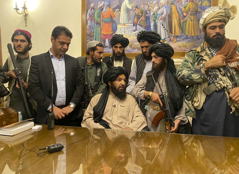 Taliban fighters take control of Afghan presidential
palace after Afghan President Ashraf Ghani fled the country, in
Kabul, Afghanistan, on Sunday.