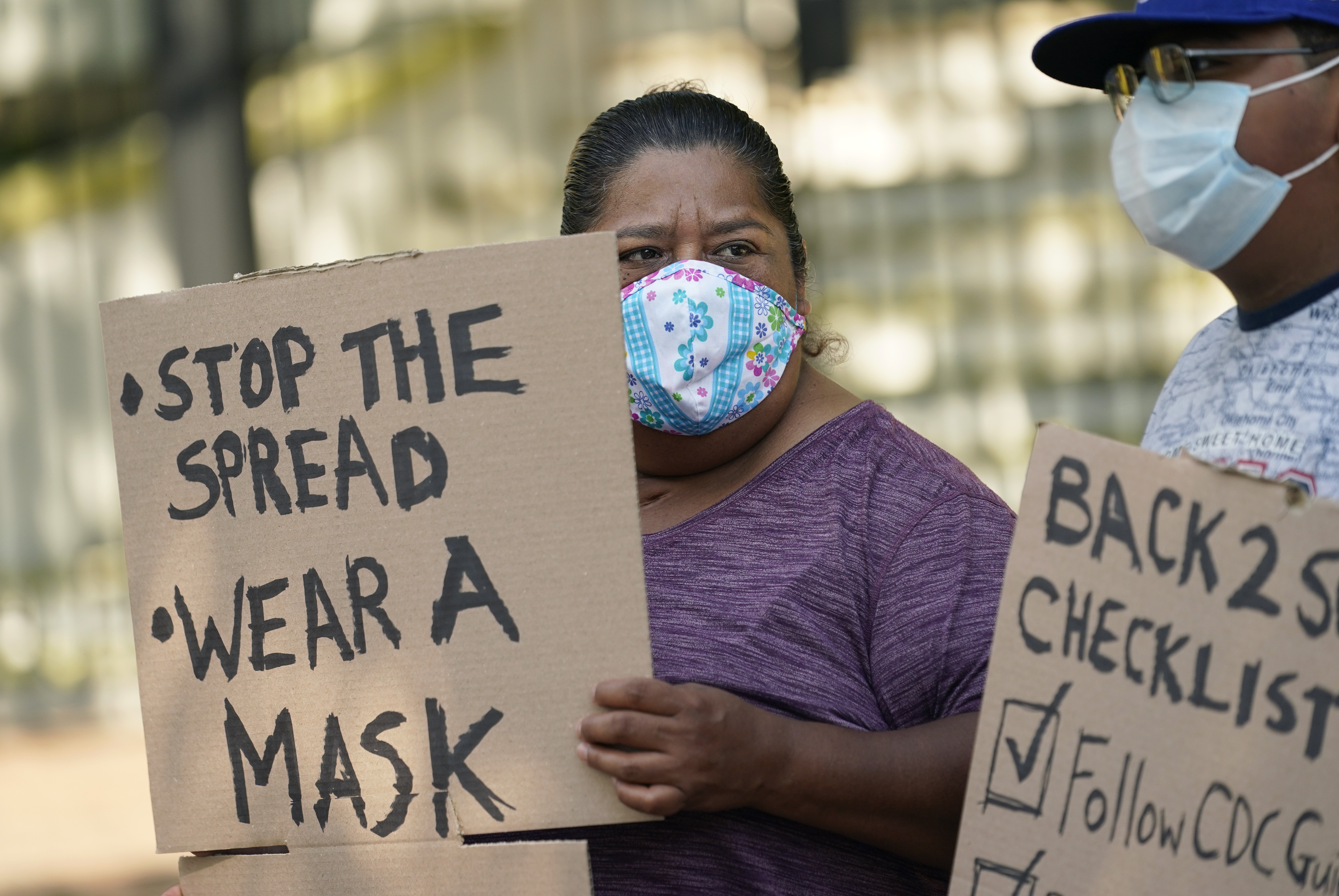 Students and parents gather outside the Governor's Mansion to urge Gov. Greg Abbott to drop his opposition to public school mask mandates, Monday, Aug. 16, 2021, in Austin, Texas.