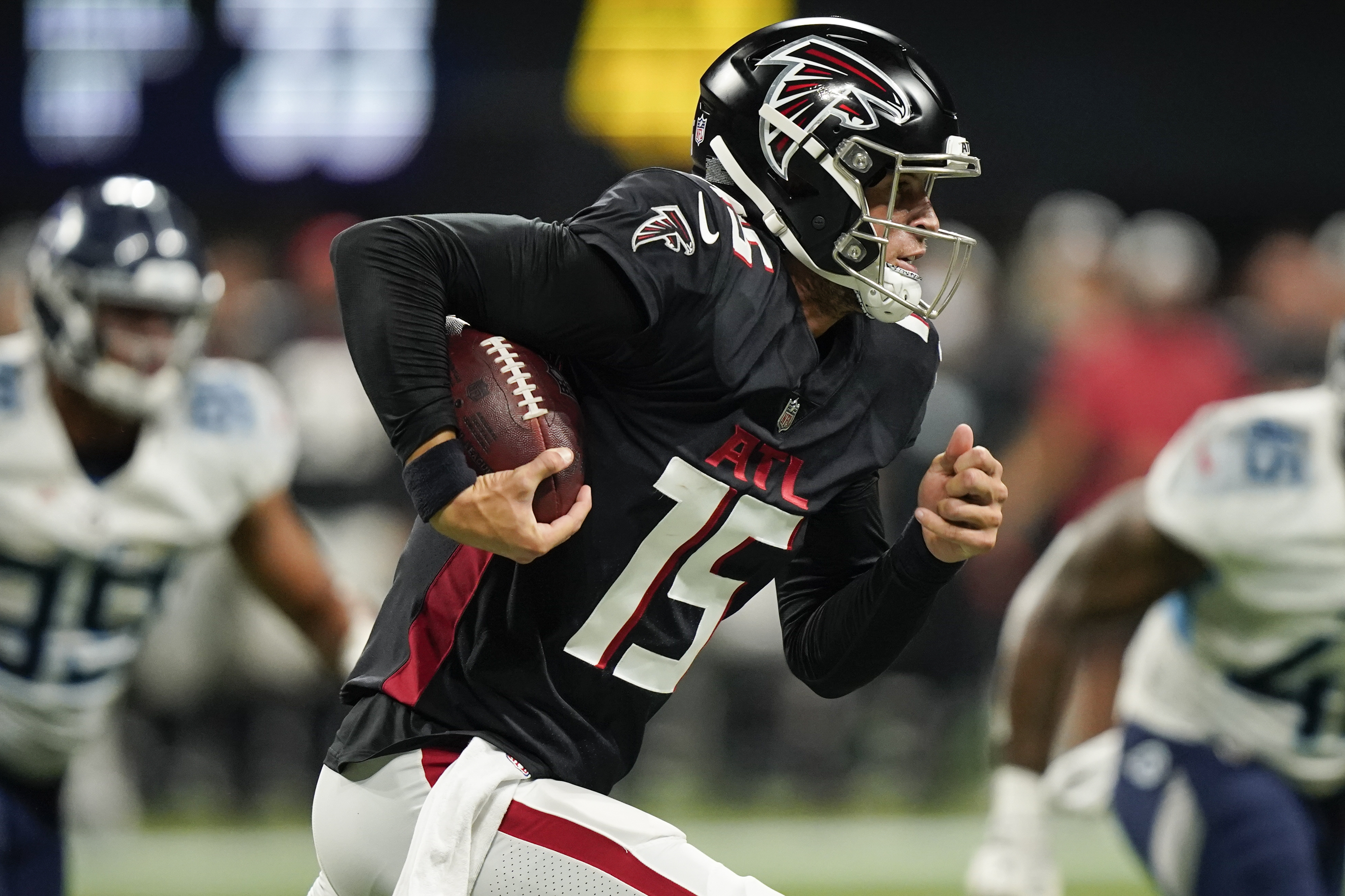 Atlanta Falcons quarterback Feleipe Franks (15) runs the ball out of the pocket against the Tennessee Titans during the second half of a preseason NFL football game, Friday, Aug. 13, 2021, in Atlanta.