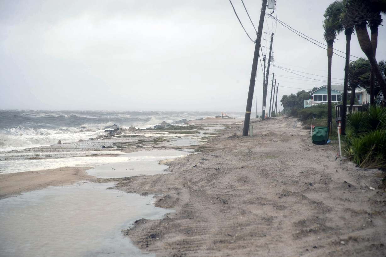 Water pools along Alligator Drive in Alligator Point, Fla., as Tropical Storm Fred brings strong winds and rain to Florida's Forgotten Coast on Monday, Aug. 16, 2021.
