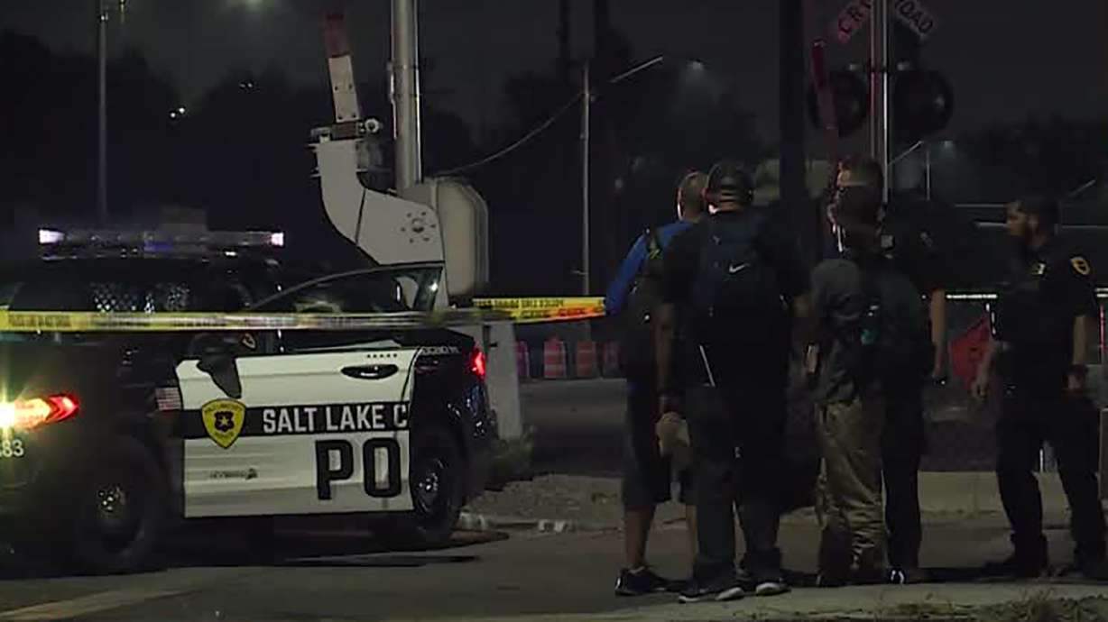 Salt Lake police respond to 900 West and South Temple where a 31-year-old woman was shot and killed on Tuesday, Aug. 17. The victim's girlfriend was charged Wednesday with murder.