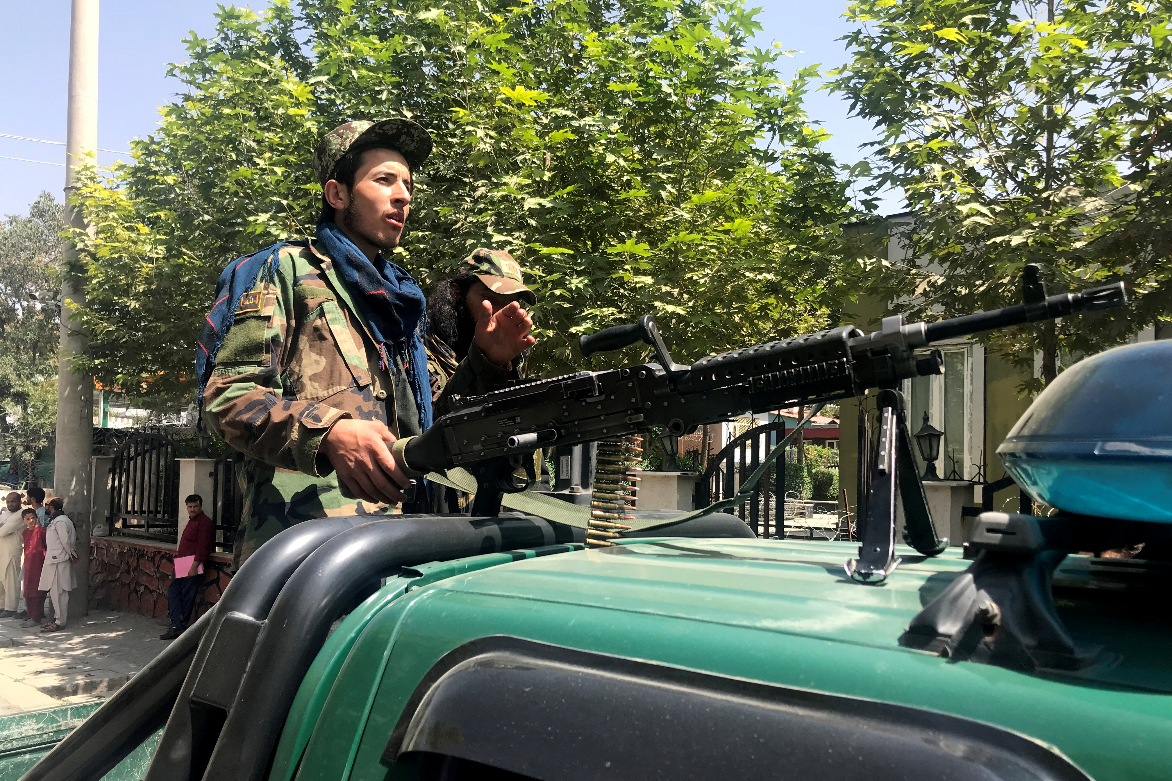 Taliban forces patrol in Kabul, Afghanistan, on Monday. The Taliban held their first official news conference in Kabul on Tuesday, declaring they wanted peaceful relations with other countries and would respect the rights of women.