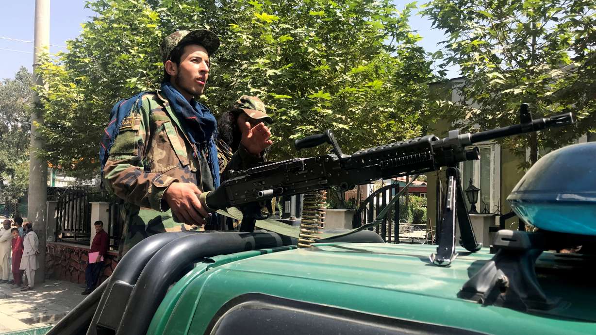 Taliban forces patrol in Kabul, Afghanistan, on Monday. The Taliban held their first official news conference in Kabul on Tuesday, declaring they wanted peaceful relations with other countries and would respect the rights of women.