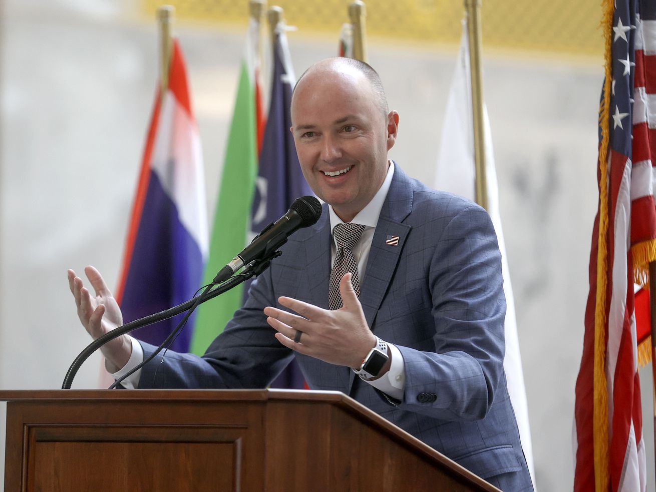 Gov. Spencer Cox speaks at a naturalization ceremony for 14 refugees at the Capitol during World Refugee Week in Salt
Lake City on June 15. Cox says the state's history informs its warm approach to refugees today. 