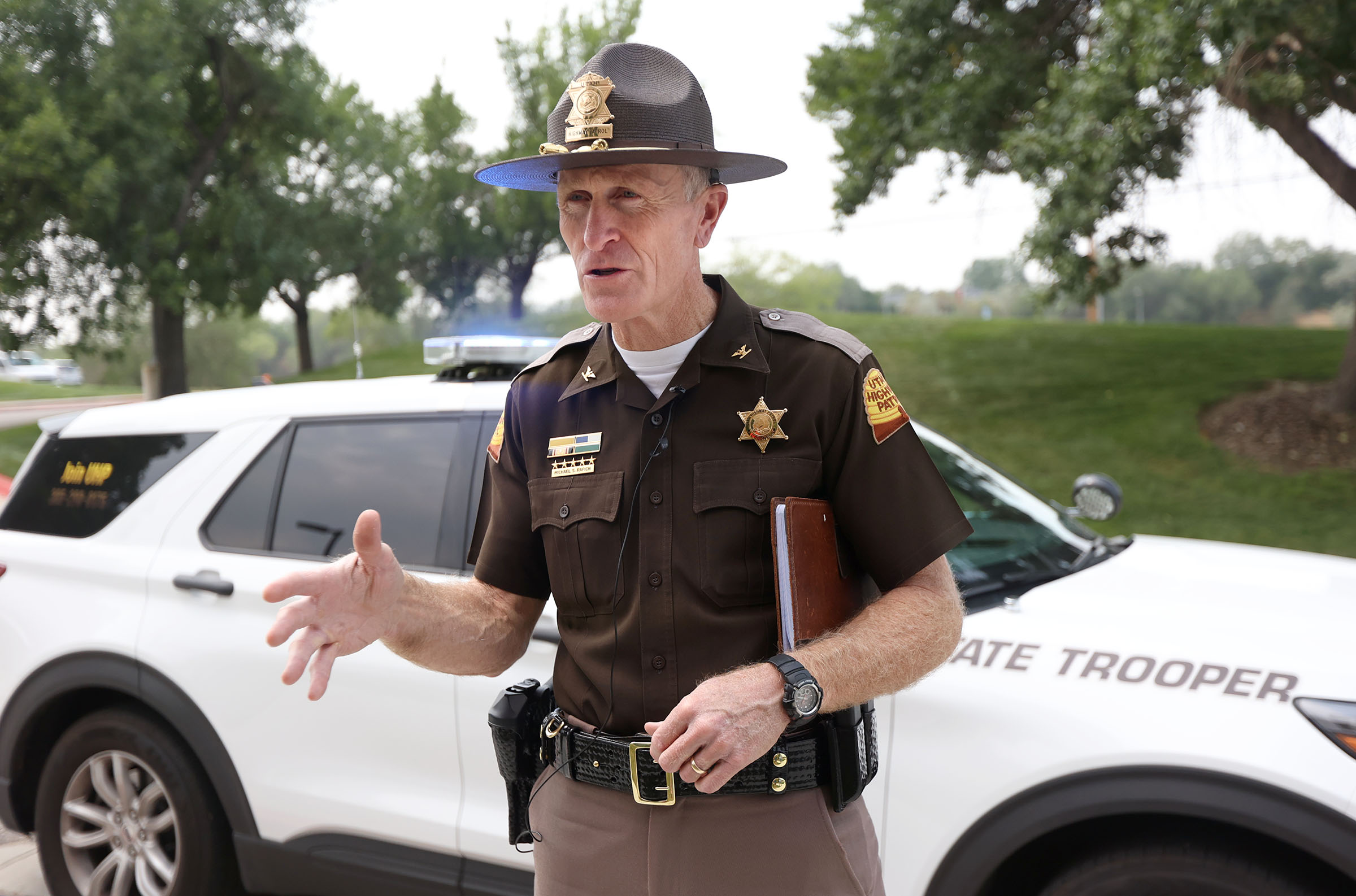 Utah Highway Patrol Col. Michael S. Rapich talks about the number of UHP troopers that have been hit while working on the side of the road during a press conference outside of UHP headquarters in Taylorsville on Tuesday, Aug. 17, 2021. Two UHP troopers have been hit while stopped on the shoulder of the road in recent weeks.