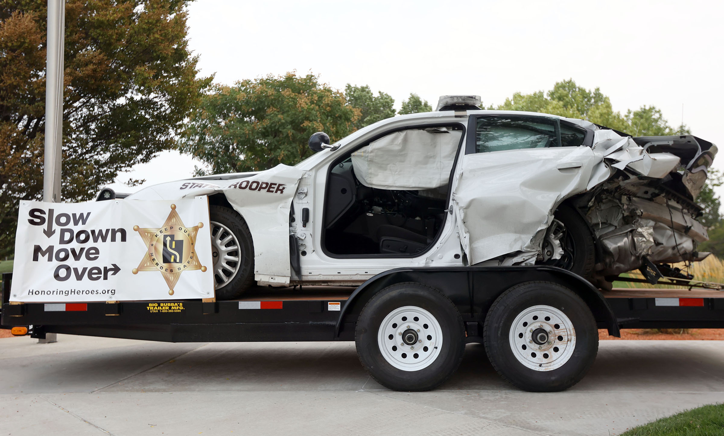 A wrecked Utah Highway Patrol vehicle is pictured outside of UHP headquarters in Taylorsville on Tuesday, Aug. 17, 2021. The vehicle is now used by the Honoring Heroes Foundation to raise awareness about moving over to give space to emergency responders working on the side of the road.