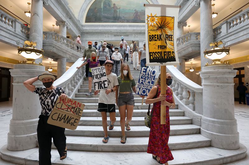 Protesters rally against what they say is a misuse of public funds for fossil fuel projects during a rally at the Capitol
in Salt Lake City on Tuesday.