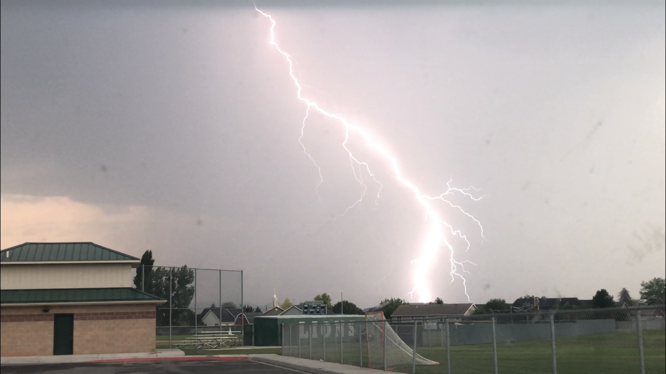 Lightning is seen striking in Santaquin during a Utah thunderstorm on Tuesday.