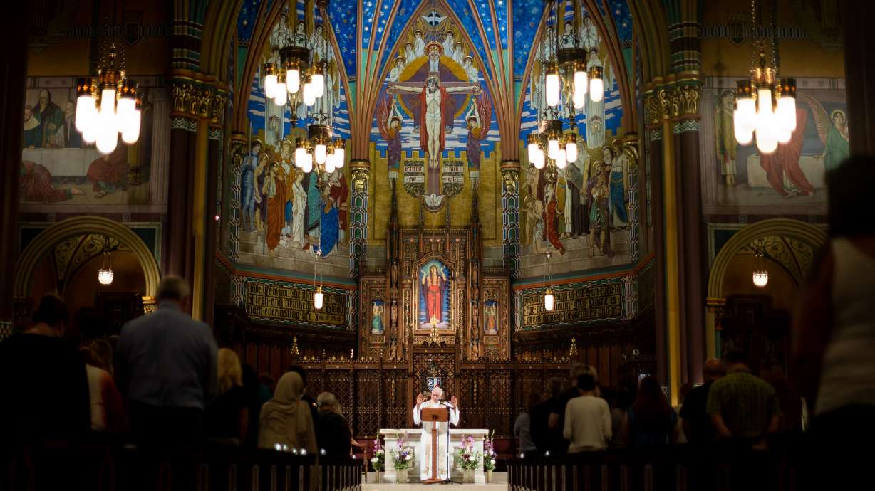 The Very Rev. Martin Diaz conducts a service at Cathedral of the Madeleine on Aug. 17, 2021. On Friday, locals joined with Catholics around the world in a prayer for peace and consecration for Russia and Ukraine.
