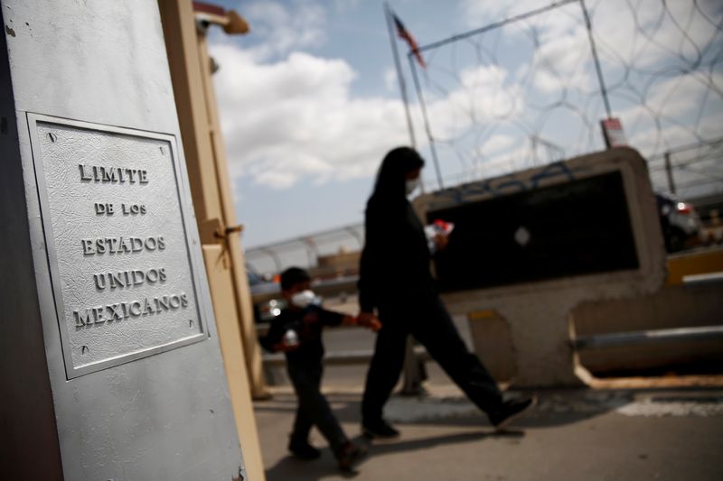 Central American migrants walk toward Mexico on the Lerdo Stanton International Bridge, as seen from Ciudad Juarez, Mexico on Tuesday. President Joe Biden's administration unveiled a plan to overhaul the U.S. asylum system to try to speed processing at the Mexico border.