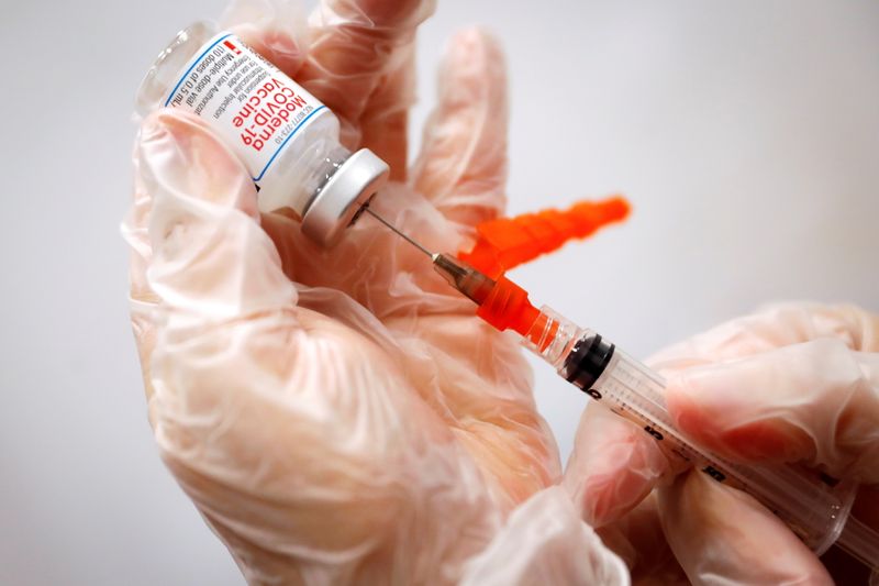 A health care worker prepares a vaccine syringe in New York Jan. 29. The U.S. government said on Wednesday it plans to make COVID-19 vaccine booster shots widely available starting Sept. 20.