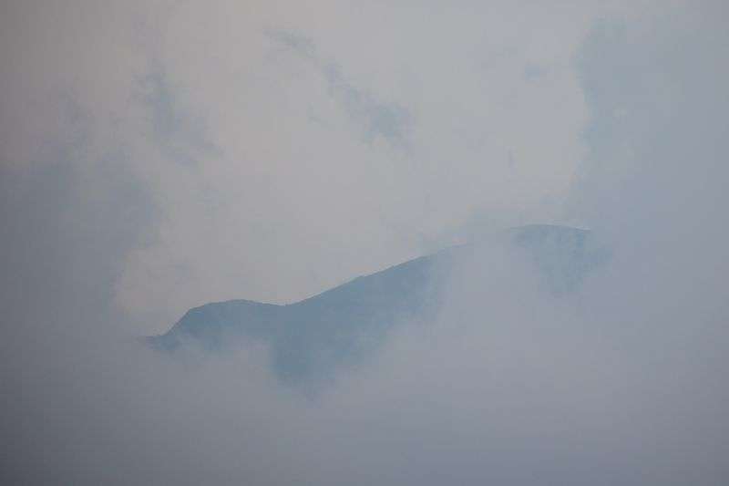 Low clouds obscure the Wasatch Mountains as rain falls
in Salt Lake City on Wednesday.