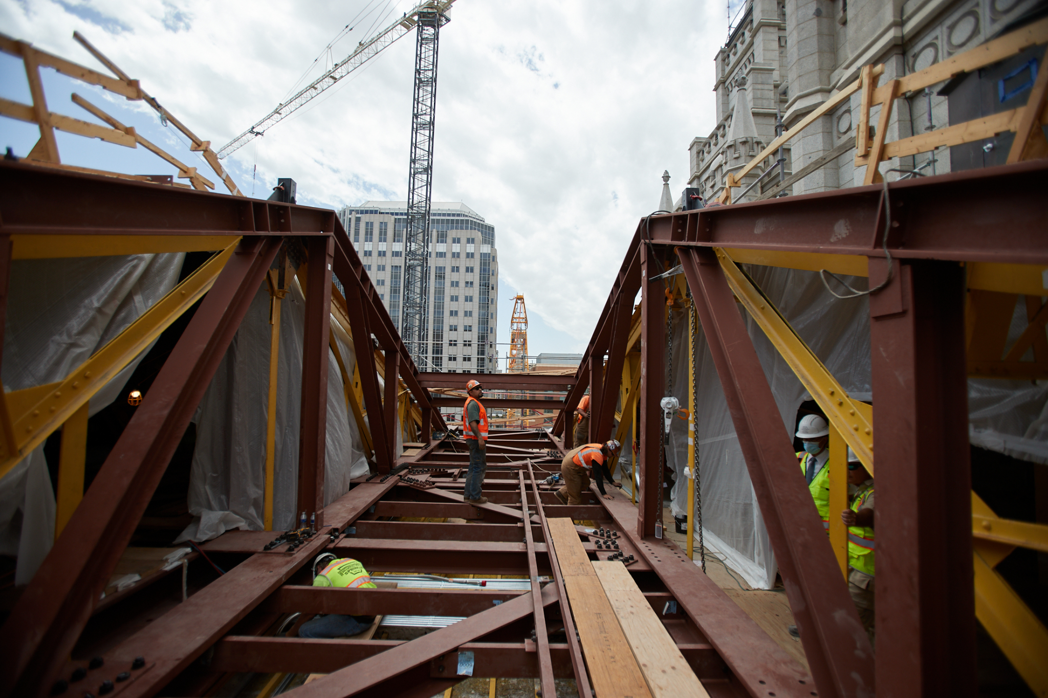 New trusses were installed in the attic, two at a time, so only a portion of the roof was exposed to protect historic finishes inside the sacred structure. The framework will help strengthen the attic for new mechanical equipment and tie the roof to the foundation to help stiffen the temple as part of the seismic upgrade.