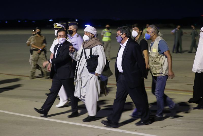 Spanish and Afghan citizens who were evacuated from Kabul arrive at Torrejon airbase in Torrejon de Ardoz, outside Madrid, Thursday.