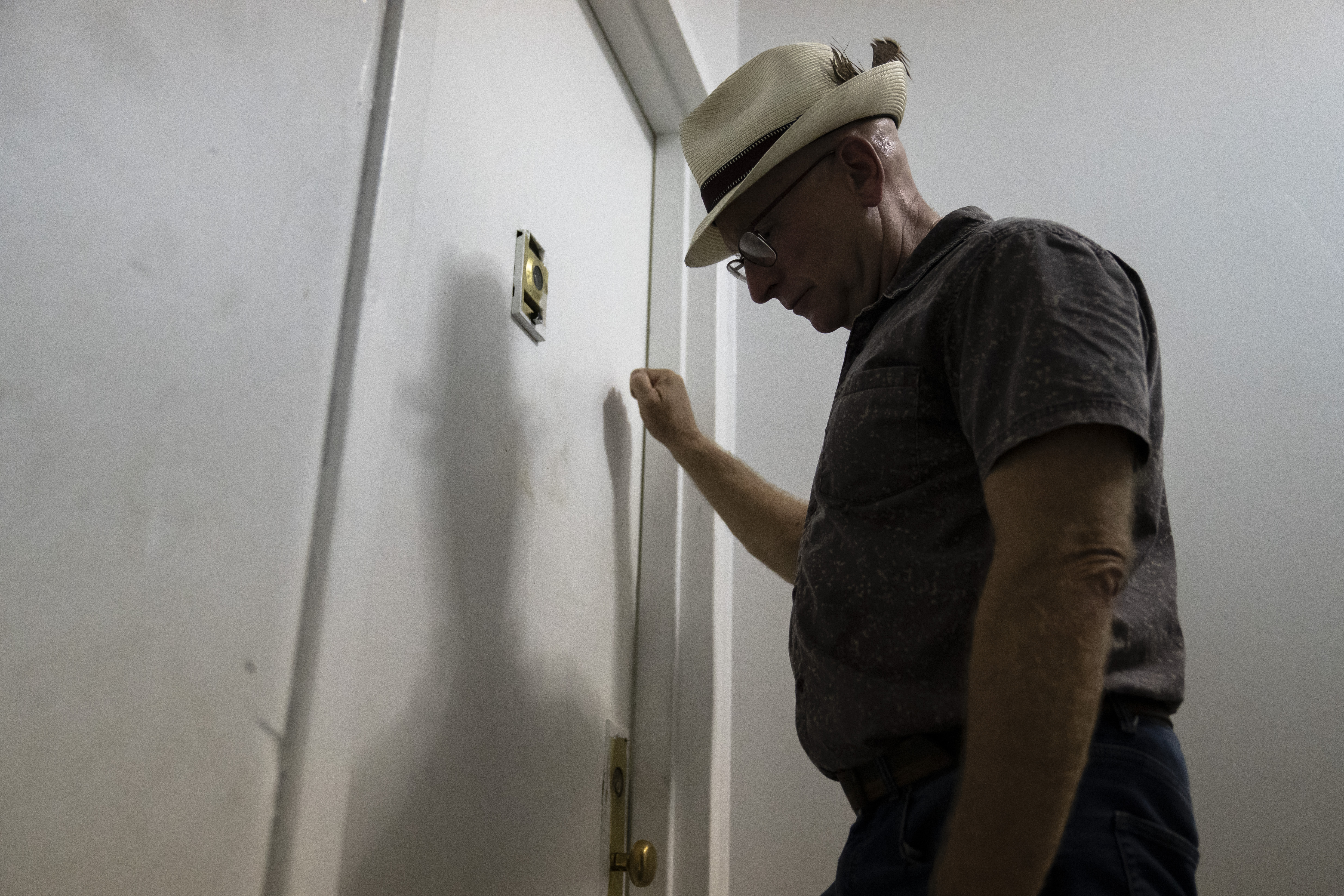 Gary Zaremba knocks on a door at one of his properties on Aug. 12 in Queens, New York. A federal appeals court on Friday said a pause on evictions can remain in place for now.