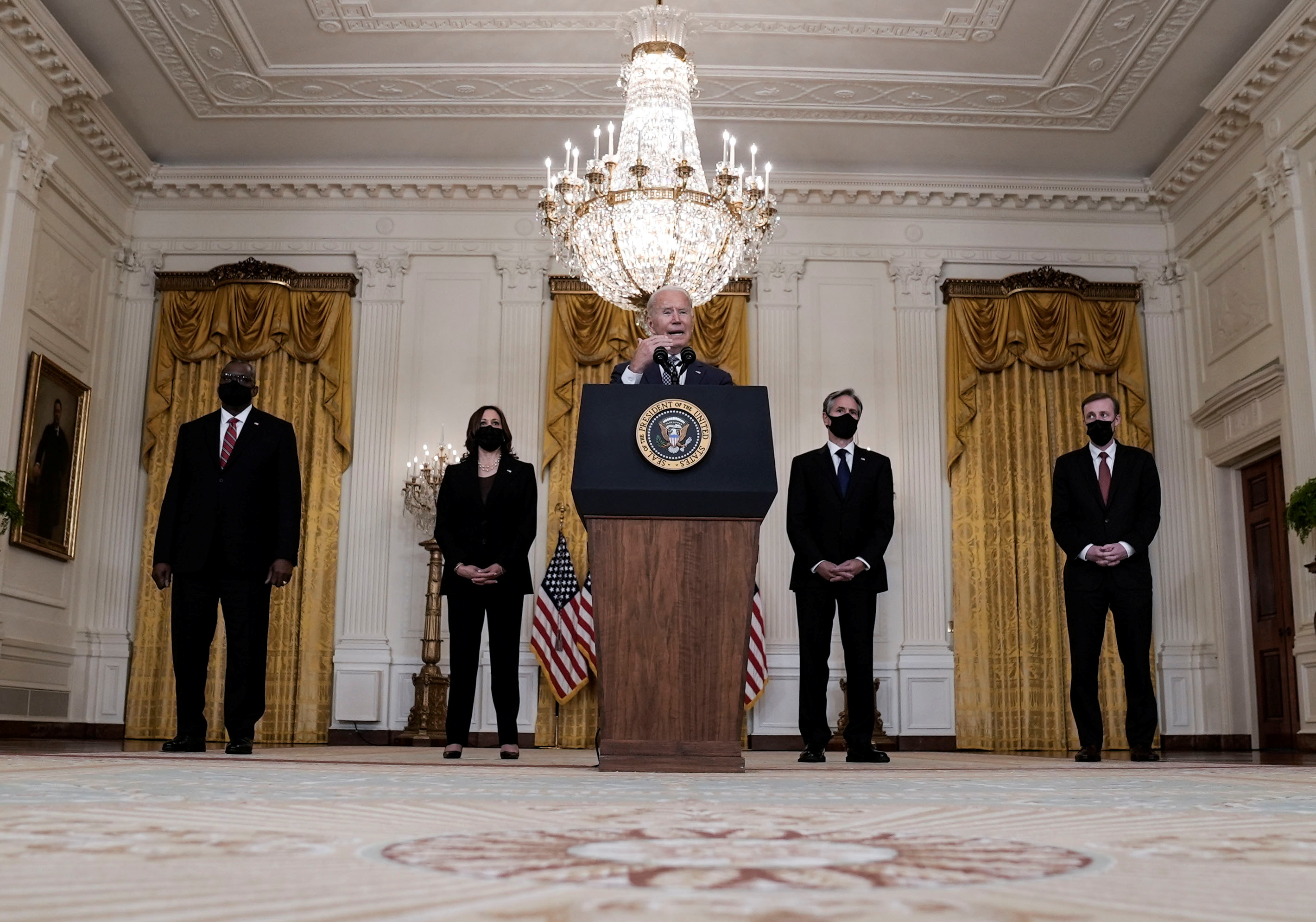 U.S. Defense Secretary Lloyd Austin, Vice President Kamala Harris, Secretary of State Antony Blinken and National Security advisor Jake Sullivan listen as President Joe Biden delivers remarks on evacuation efforts and the ongoing situation in Afghanistan during a speech in the East Room at the White House in Washington D.C., on Friday.