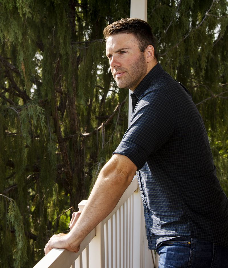 Jeremy Ruppe, a Marine who served with the 4th Light
Armored Reconnaissance Battalion in Afghanistan, poses for photos
at his home in Lindon on Friday.