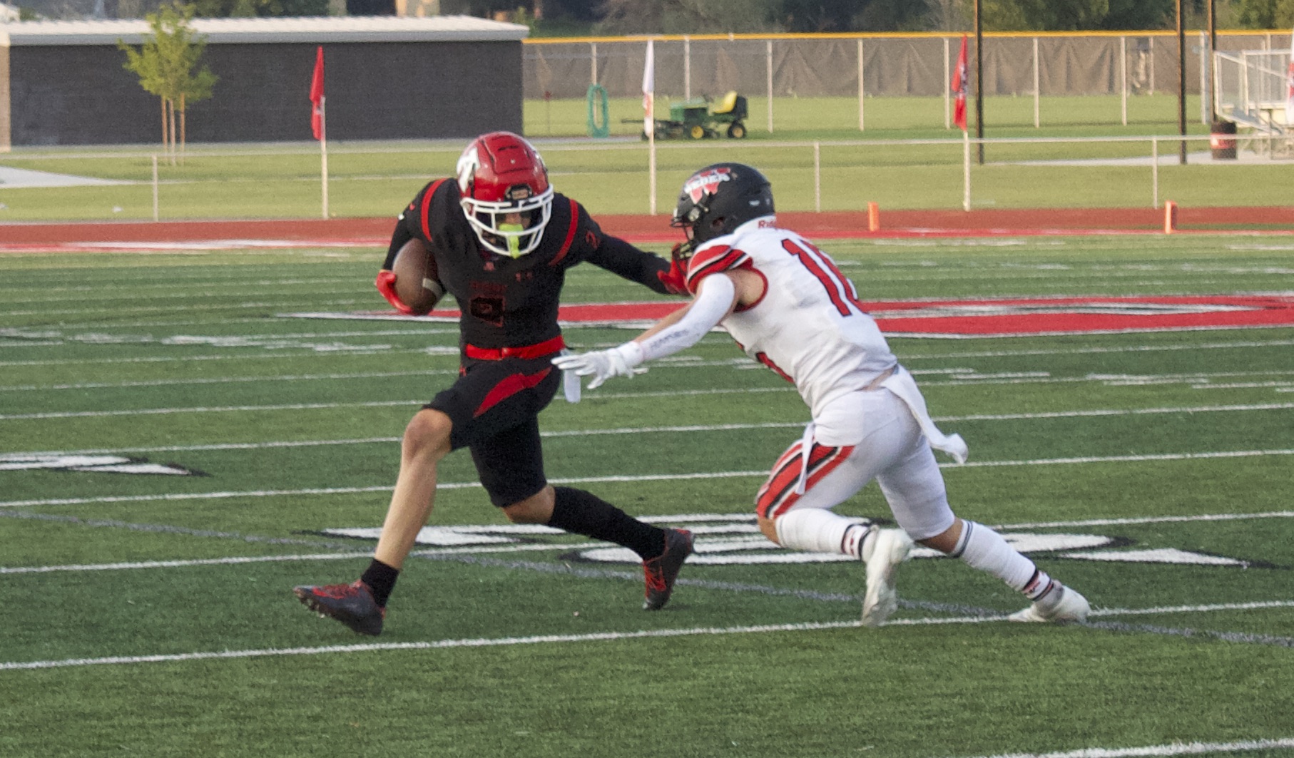 American Fork's Fisher Ingersoll stiff arms a defender during the Cavemen's 45-14 win over Weber, Friday, Aug. 20, 2021.