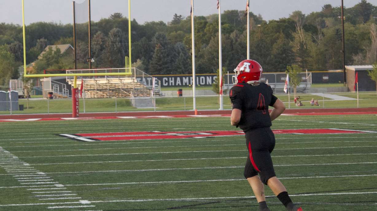 American Fork quarterback Maddux Madsen jogs off the field after scoring on a QB sneak during the Cavemen's 45-14 win over Weber, Friday, Aug. 20, 2021.