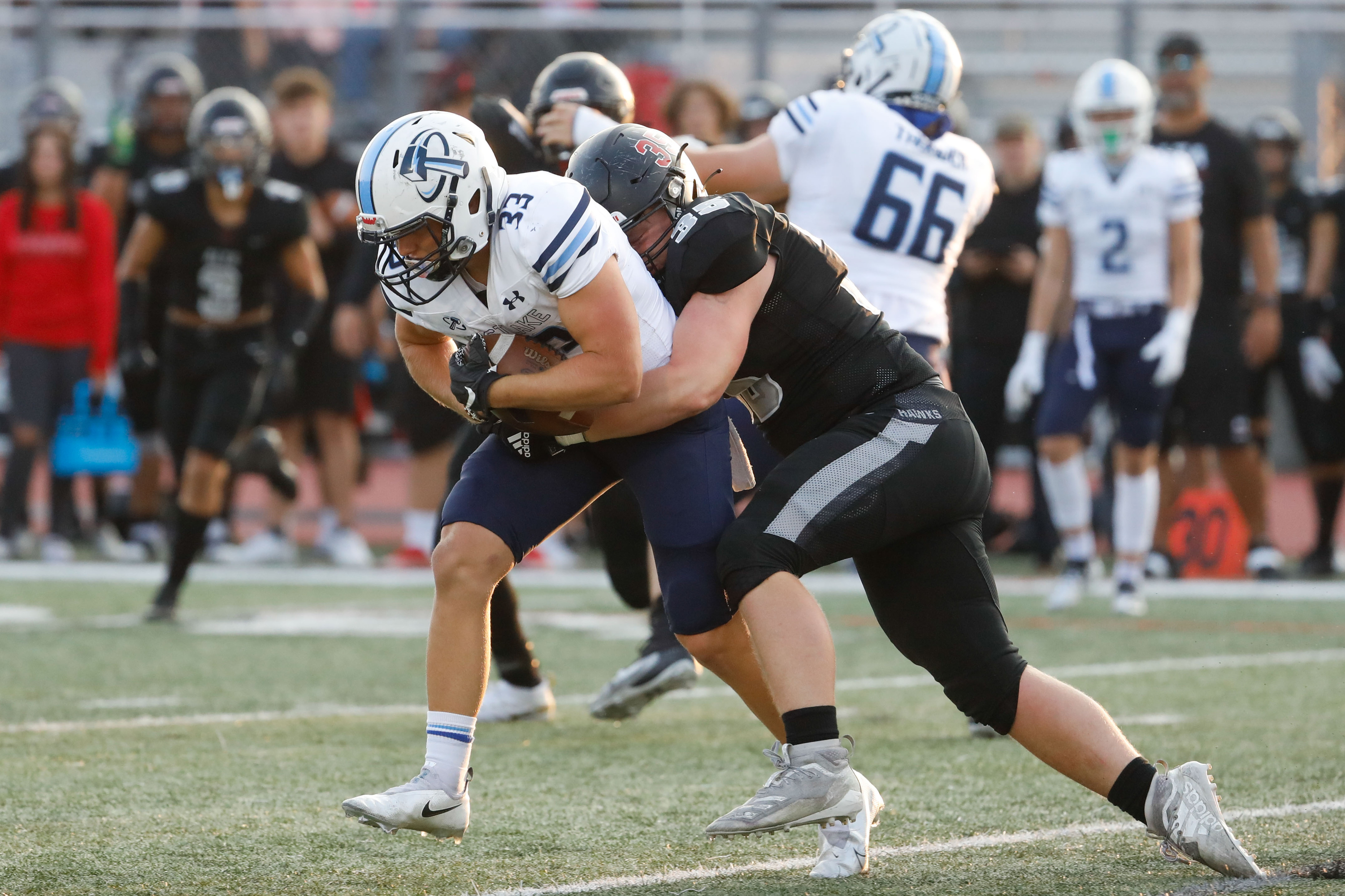 Westlakeâs CB Kanyon Lee (33) is pressured by Altaâs RB  Ian Smith during a high school football game on Friday, Aug. 20, 2021 at Alta High School in Sandy .