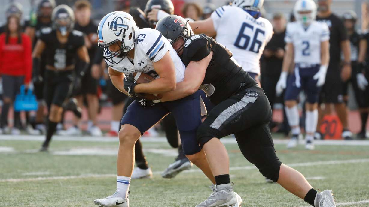 Westlakeâs CB Kanyon Lee (33) is pressured by Altaâs RB Ian Smith during a high school football game on Friday, Aug. 20, 2021 at Alta High School in Sandy .