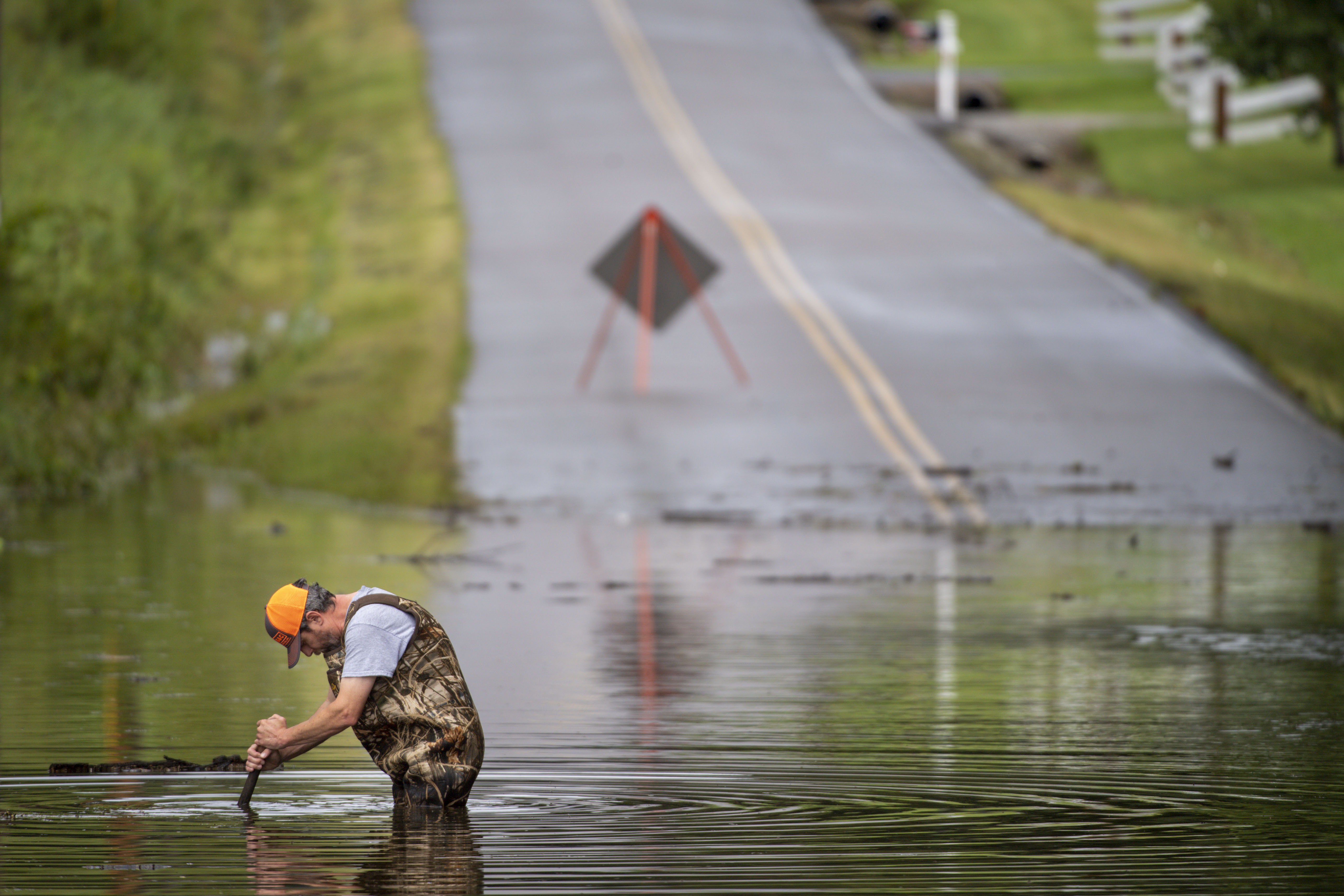 Dickson Public Works personnel check the flooding on Old Pond Lane following heavy rainfall on Saturday in Dickson, Tennessee. 