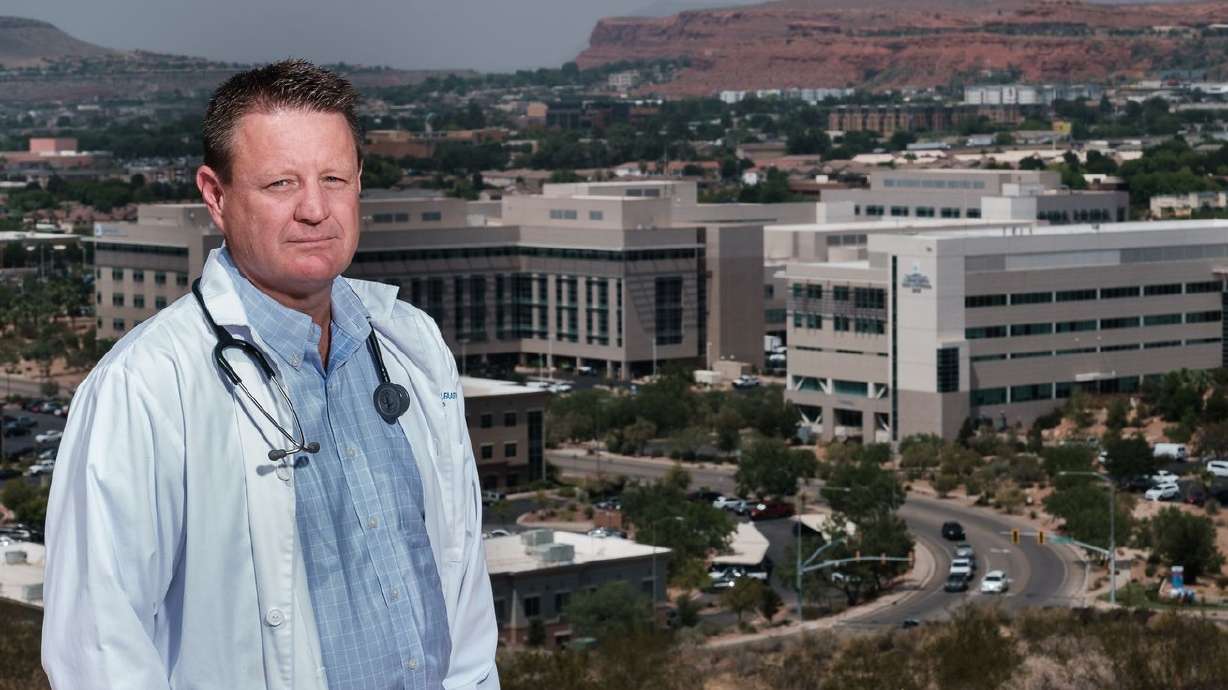Dr. David Grygla, hospitalist at a St. George hospital, poses for a portrait with the St. George skyline behind him on
Thursday. Grygla is encouraging residents to get vaccinated for COVID-19.