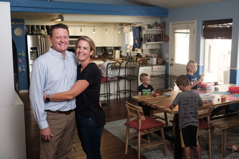 Dr. David Grygla, left, hospitalist at a St. George hospital, and his wife, Julie, pose for a portrait at their home in
St. George on Thursday with their children Jonathan, Emily, Brady, Abraham, Christian and Eliza.