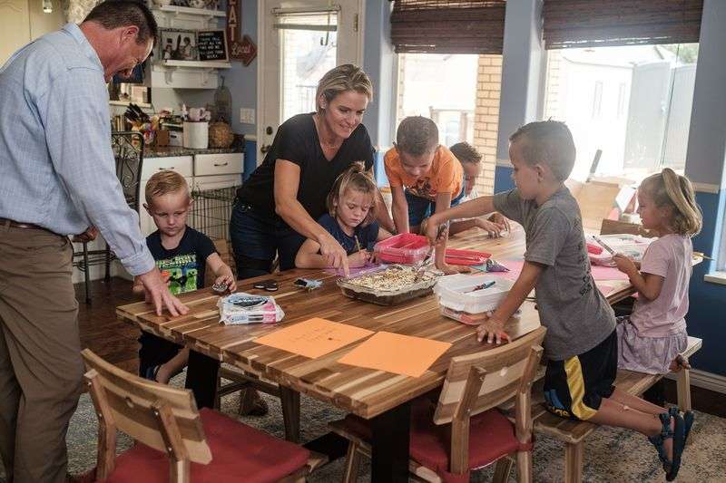 Dr. David Grygla, left, a hospitalist at a St. George hospital, and his wife, Juliet, break out treats for their children, Jonathan, left, Emily, Brady, Abraham, Christian and Eliza, at their home in St. George on Thursday.