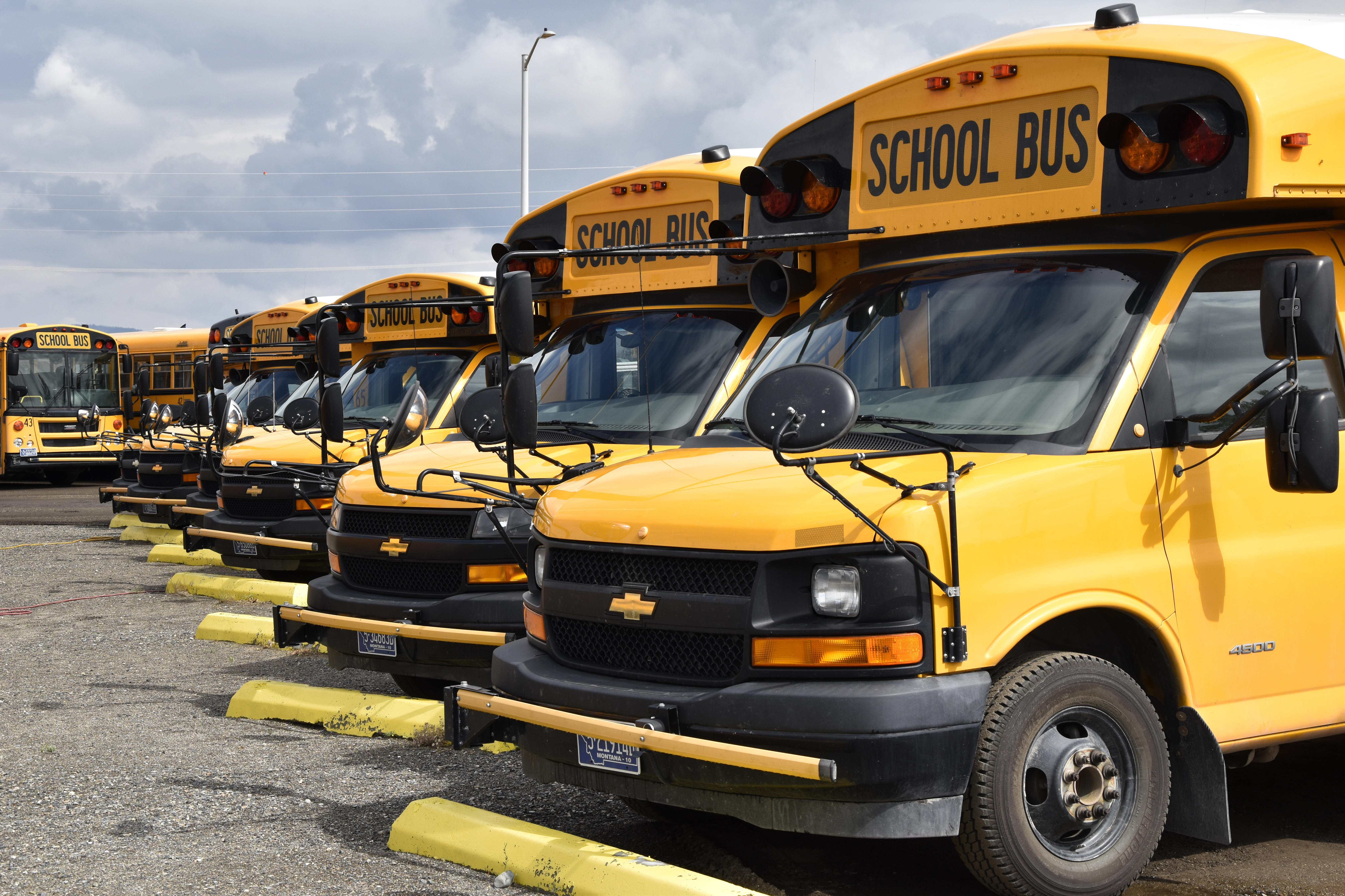 School buses parked in Helena, Mont., ahead of the beginning of the school year, Friday. School districts across the country are coping with a shortage of bus drivers, a dilemma that comes even as they struggle to start a new school year during a new surge of the coronavirus pandemic.