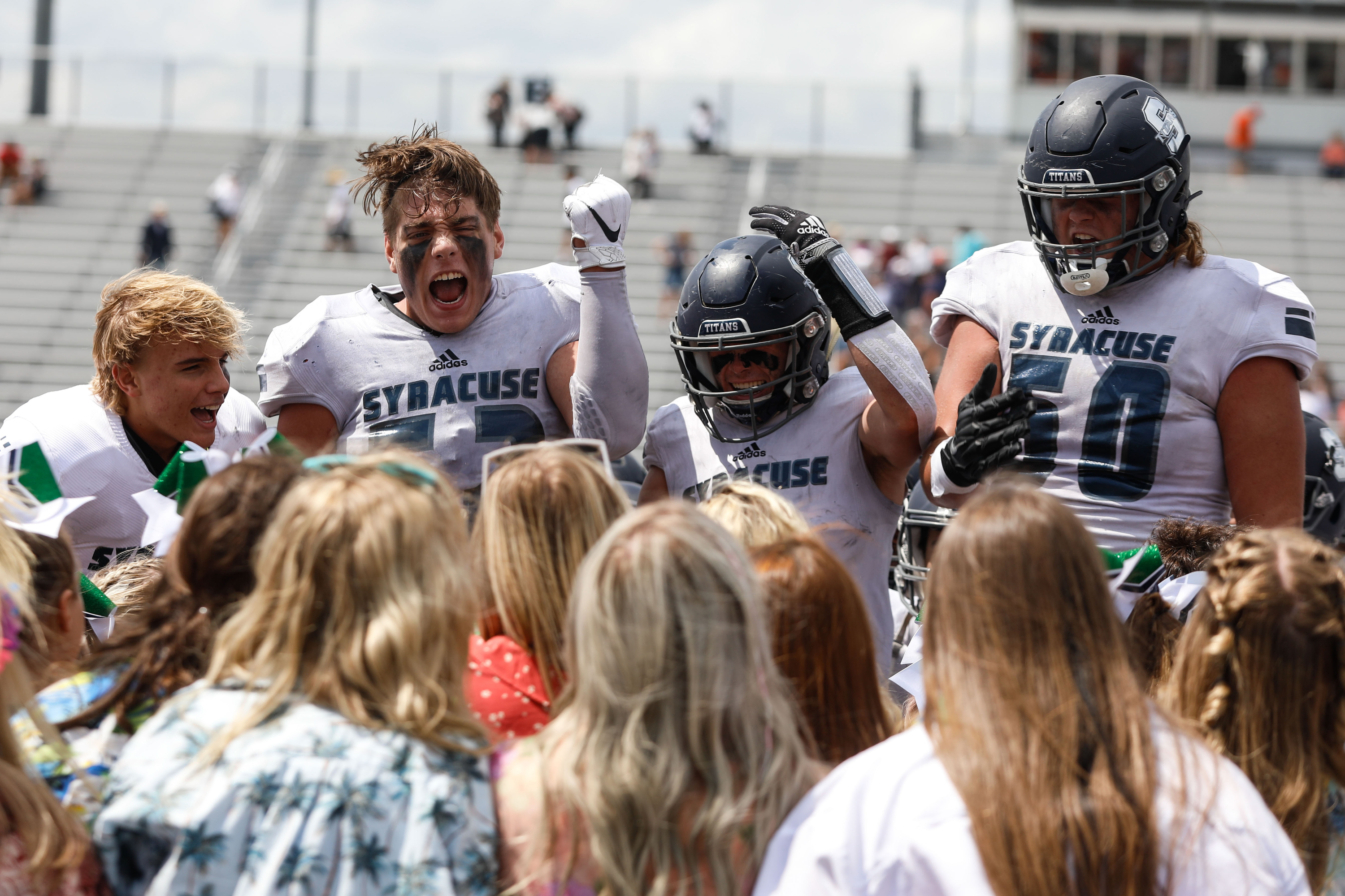 Syracuse football players cheer with the crowd after winning 31-7 against Brighton High on Saturday, Aug. 21, 2021, at Corner Canyon High School in Draper.