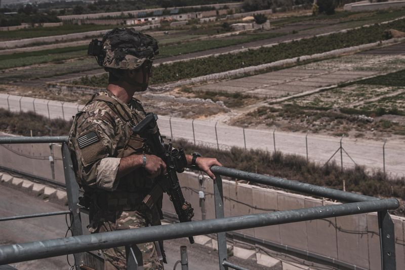A soldier assigned to the 82nd Airborne Division provides security at Hamid Karzai International Airport in Afghanistan Sunday. 