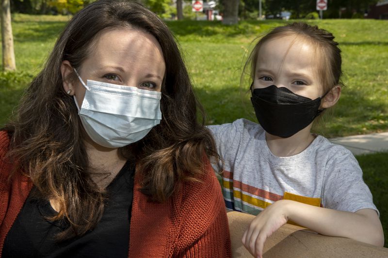 Ashley Weitz, who is among a group of parent plaintiffs who are calling into question the constitutionality of laws.
limiting schools’ capacity to safely serve students during an
ongoing pandemic, poses for photos with son Ezra, 7, in Salt Lake
City on Friday, Aug. 20, 2021.