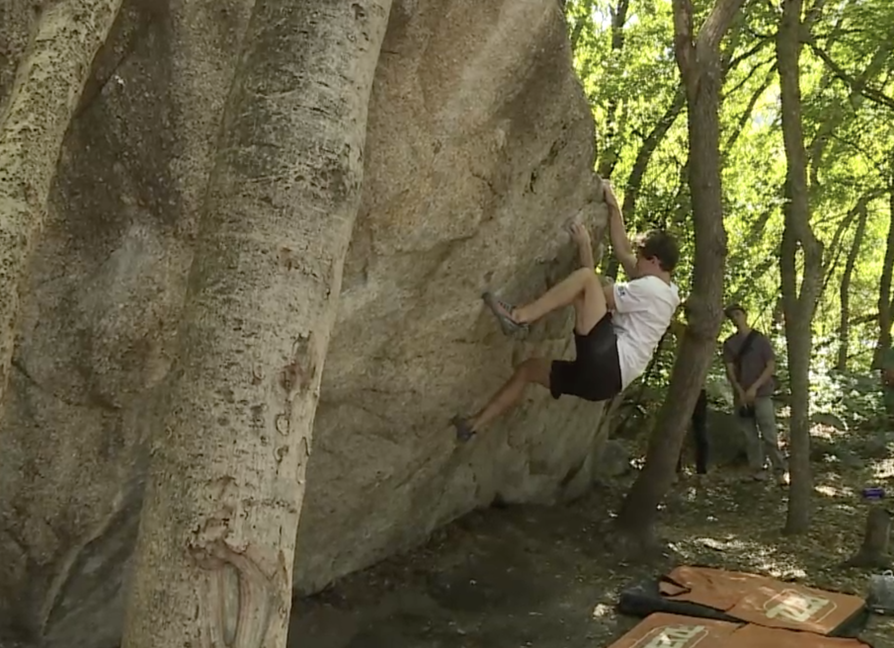Utah Olympian Nathaniel Coleman climbs a boulder in Little Cottonwood Canyon on Monday. Coleman, who won a silver medal in the 2020 Tokyo Games, said he doesn't support either Utah Department of Transportation plan for Little Cottonwood Canyon.