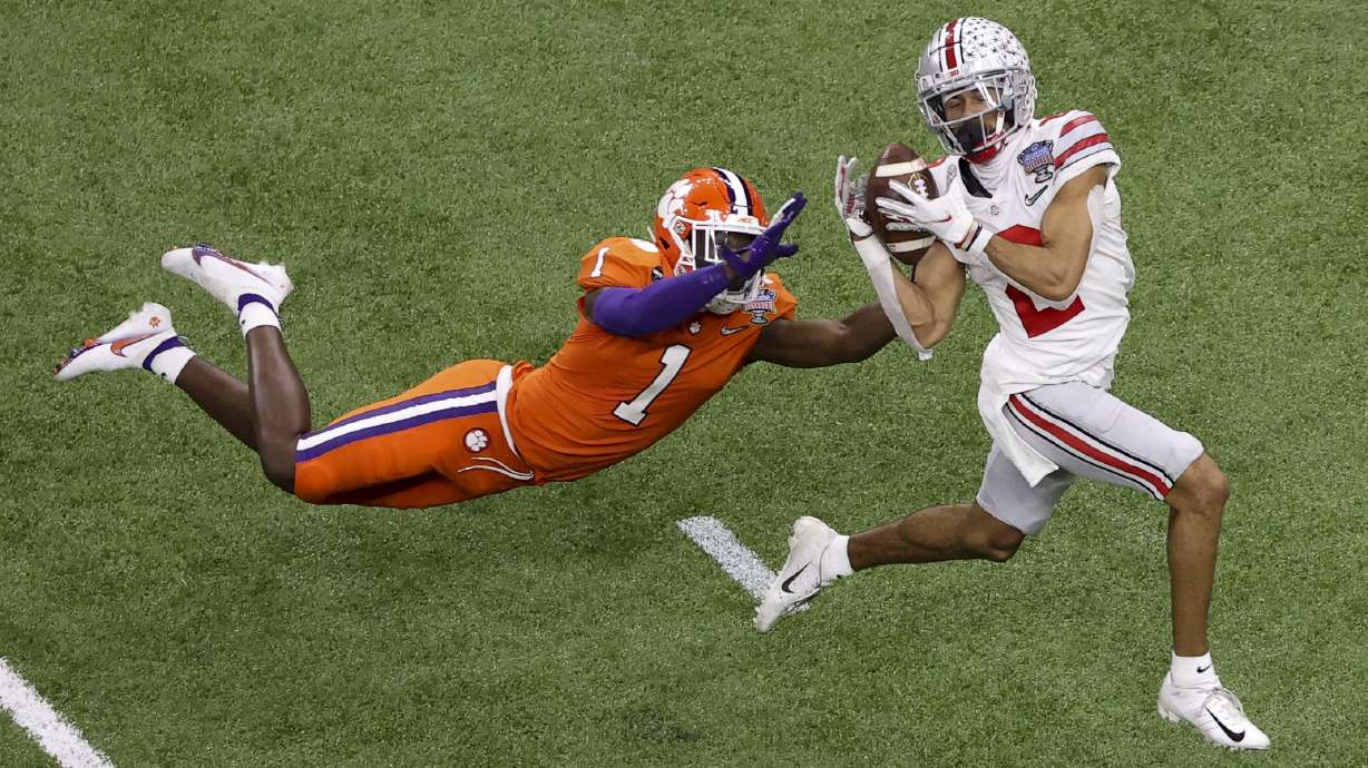 Ohio State wide receiver Chris Olave catches a touchdown pass in front of Clemson cornerback Derion Kendrick during the second half of the Sugar Bowl NCAA college football game in New Orleans, in this Jan. 1, 2021 photo.