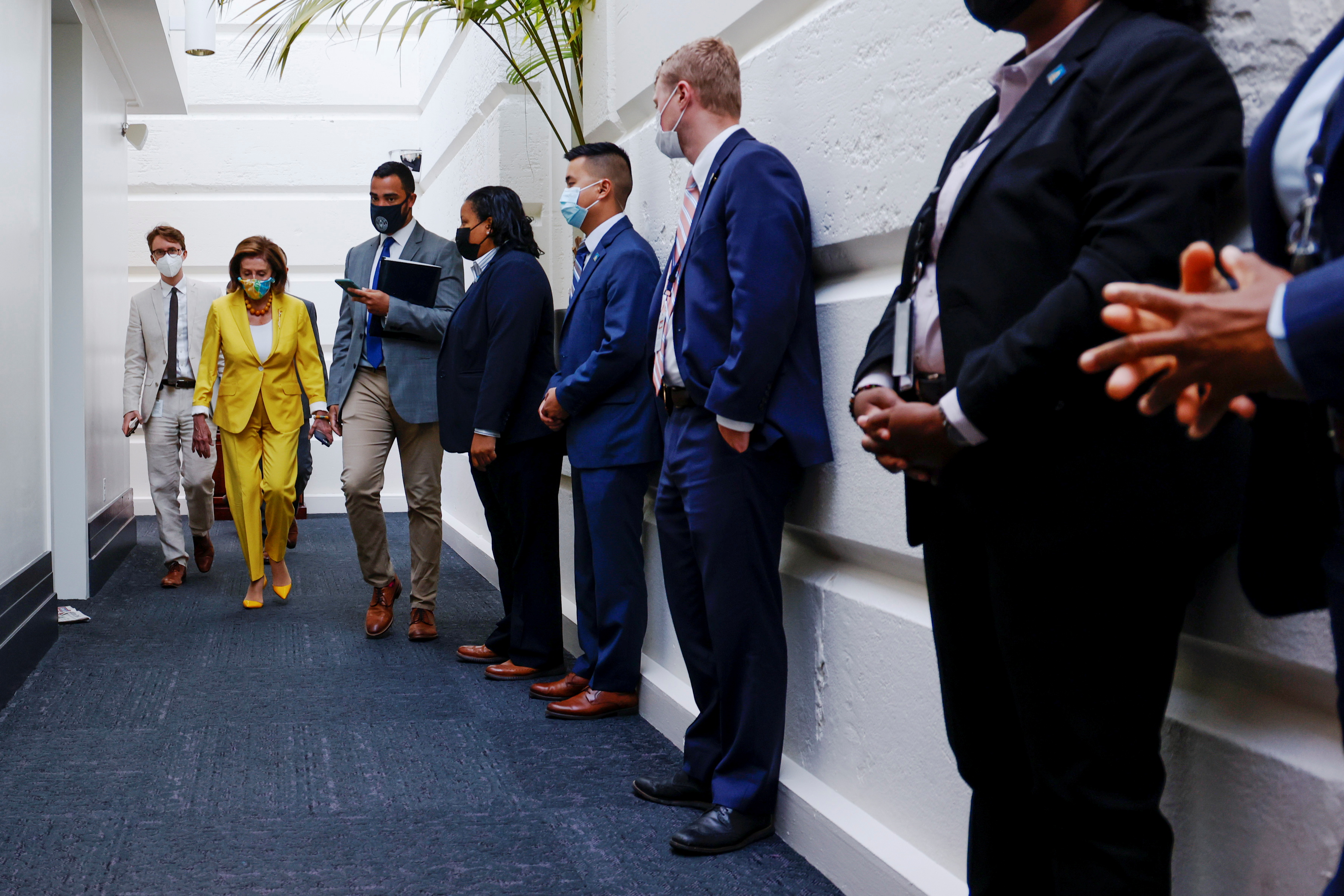 U.S. House Speaker Nancy Pelosi arrives for a House Democratic caucus meeting amidst ongoing negotiations over budget and infrastructure legislation at the U.S. Capitol on Tuesday.