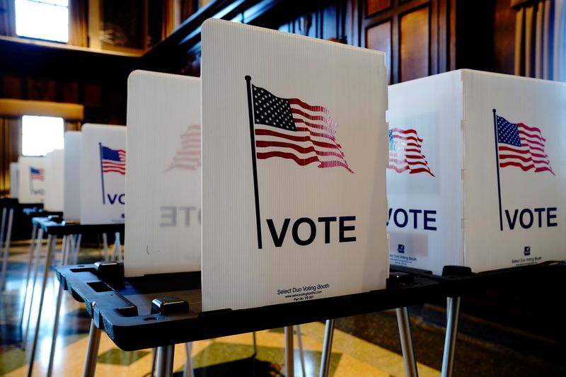 Privacy booths are seen on Election Day in Madison, Wisconsin, Nov. 3, 2020. The U.S. House of Representatives on Tuesday approved a voting rights measure.