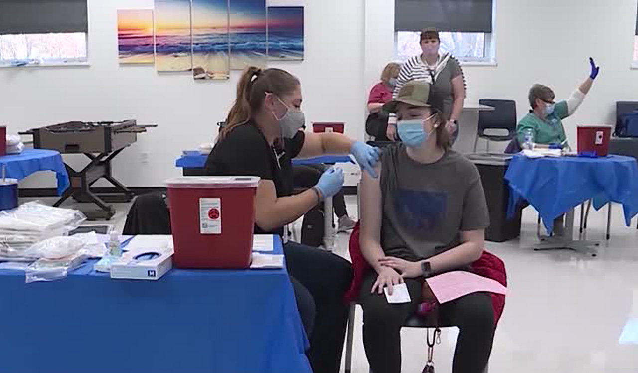 An individual receives a COVID-19 vaccination in Salt Lake City Tuesday. Utah health officials reported 1,635 new COVID-19 cases on Friday.