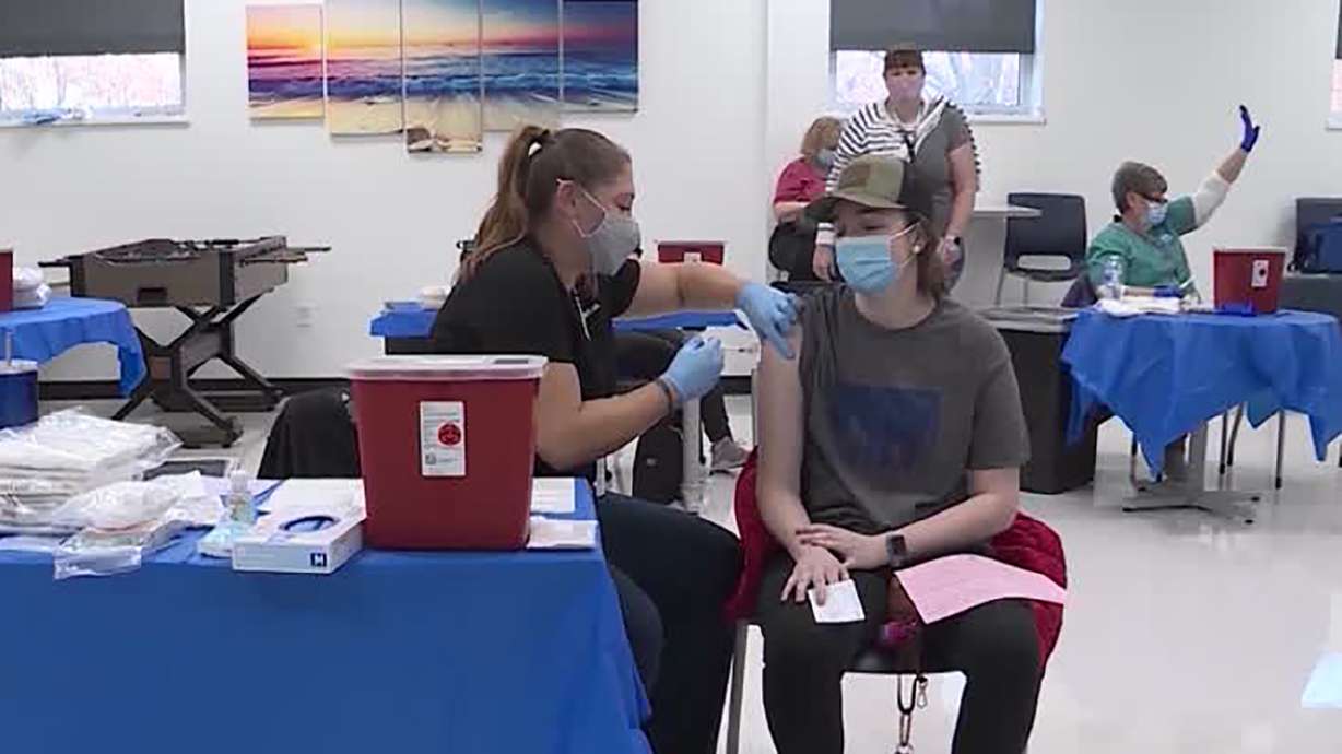 An individual receives a COVID-19 vaccination in Salt Lake City. Utah health officials reported 1,885 new COVID-19 cases on Wednesday, as well as 11 deaths.