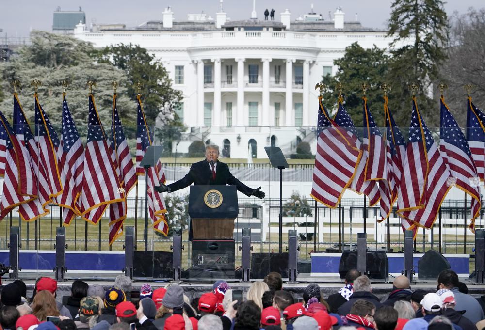 In this Jan. 6 photo with the White House in the background, President Donald Trump speaks at a rally in Washington. The House committee investigating the January insurrection at the U.S. Capitol is demanding a trove of records from federal intelligence and law enforcement agencies.