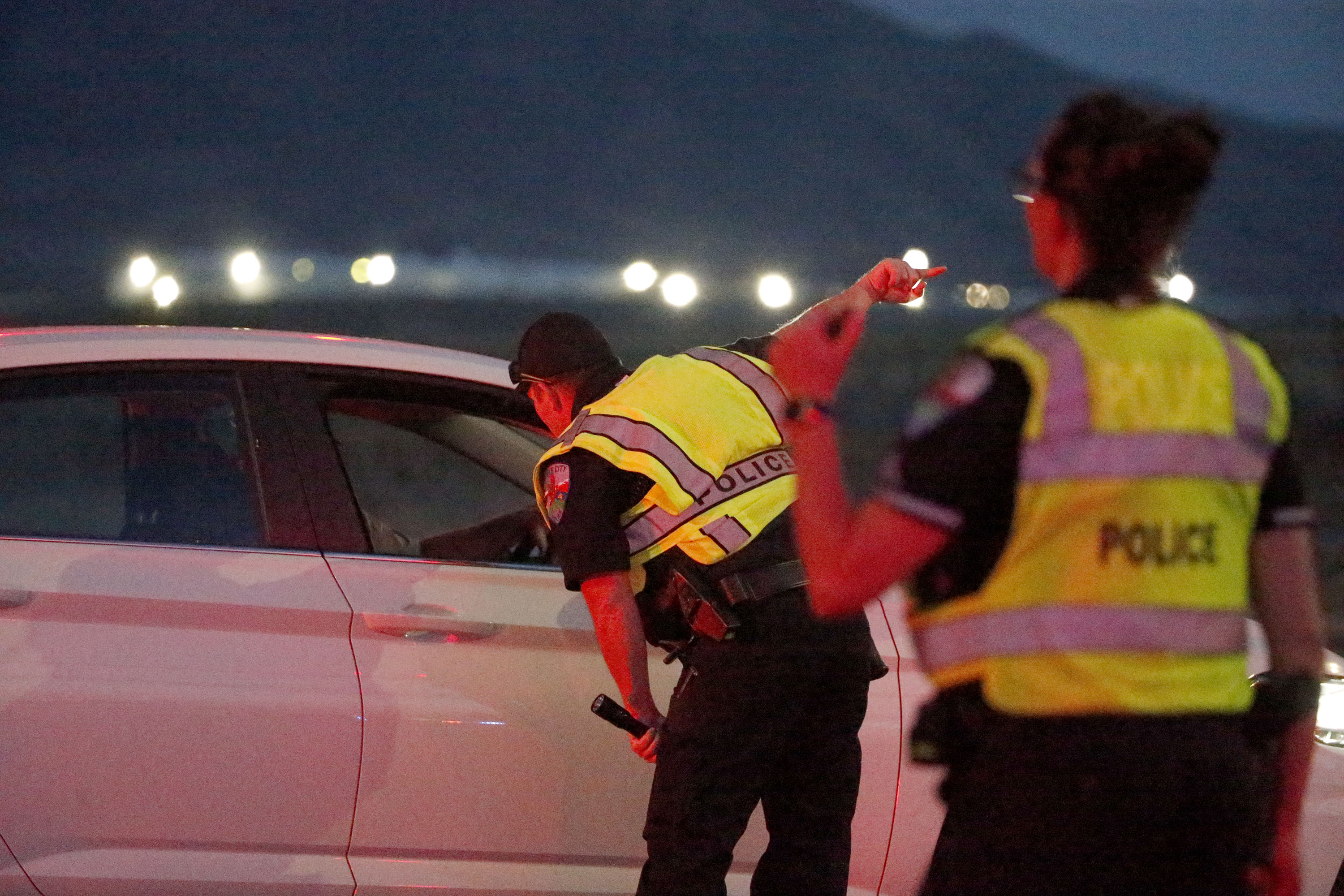 Police officers direct traffic away from a shooting incident on state Route 112 between Grantsville and Tooele on Wednesday.