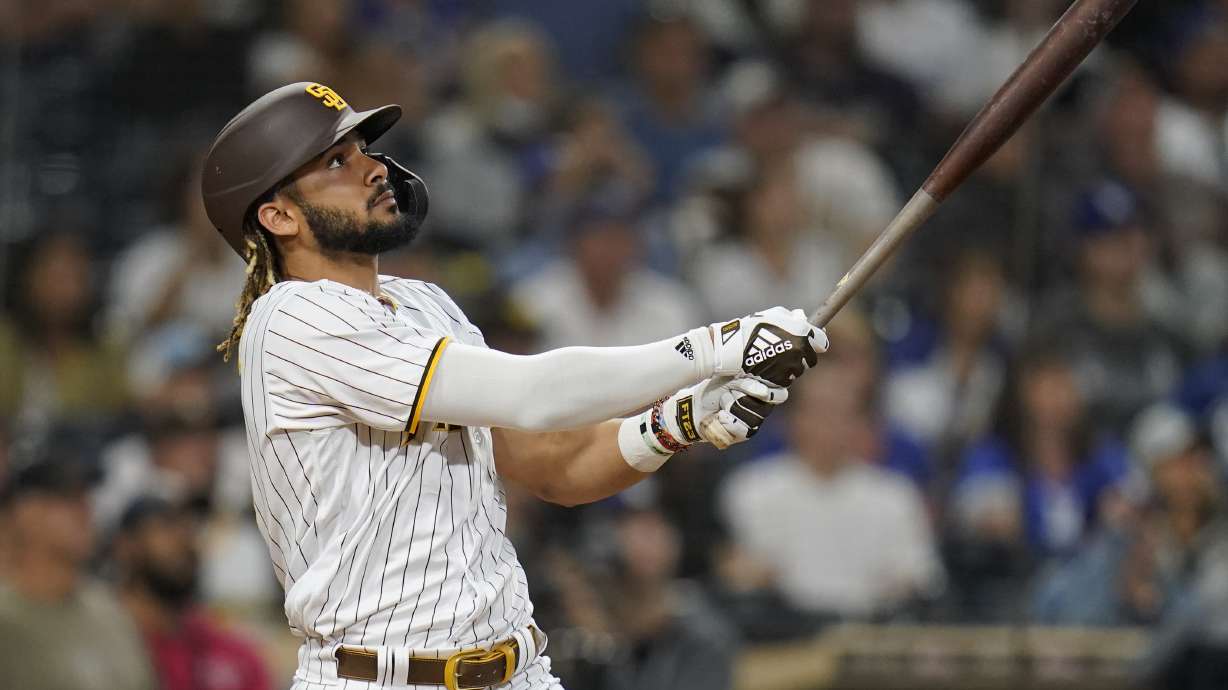 San Diego Padres' Fernando Tatis Jr. watches his two-run home run hit during the fifteenth inning of a baseball game against the Los Angeles Dodgers, Thursday, Aug. 26, 2021, in San Diego.