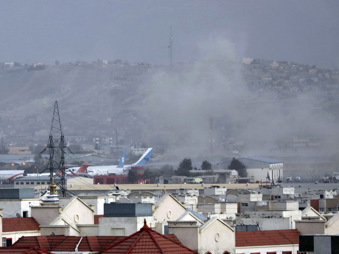 Smoke rises from a deadly explosion outside of the airport in Kabul, Afghanistan, on Thursday. Two
suicide bombers and gunmen targeted crowds massing near the Kabul airport.