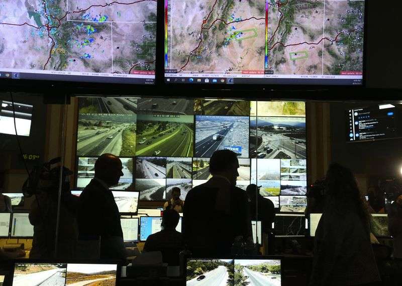 Utah Sen. Mitt Romney tours the Utah Department of
Transportation’s Traffic Operations Center in Salt Lake City on
Thursday.