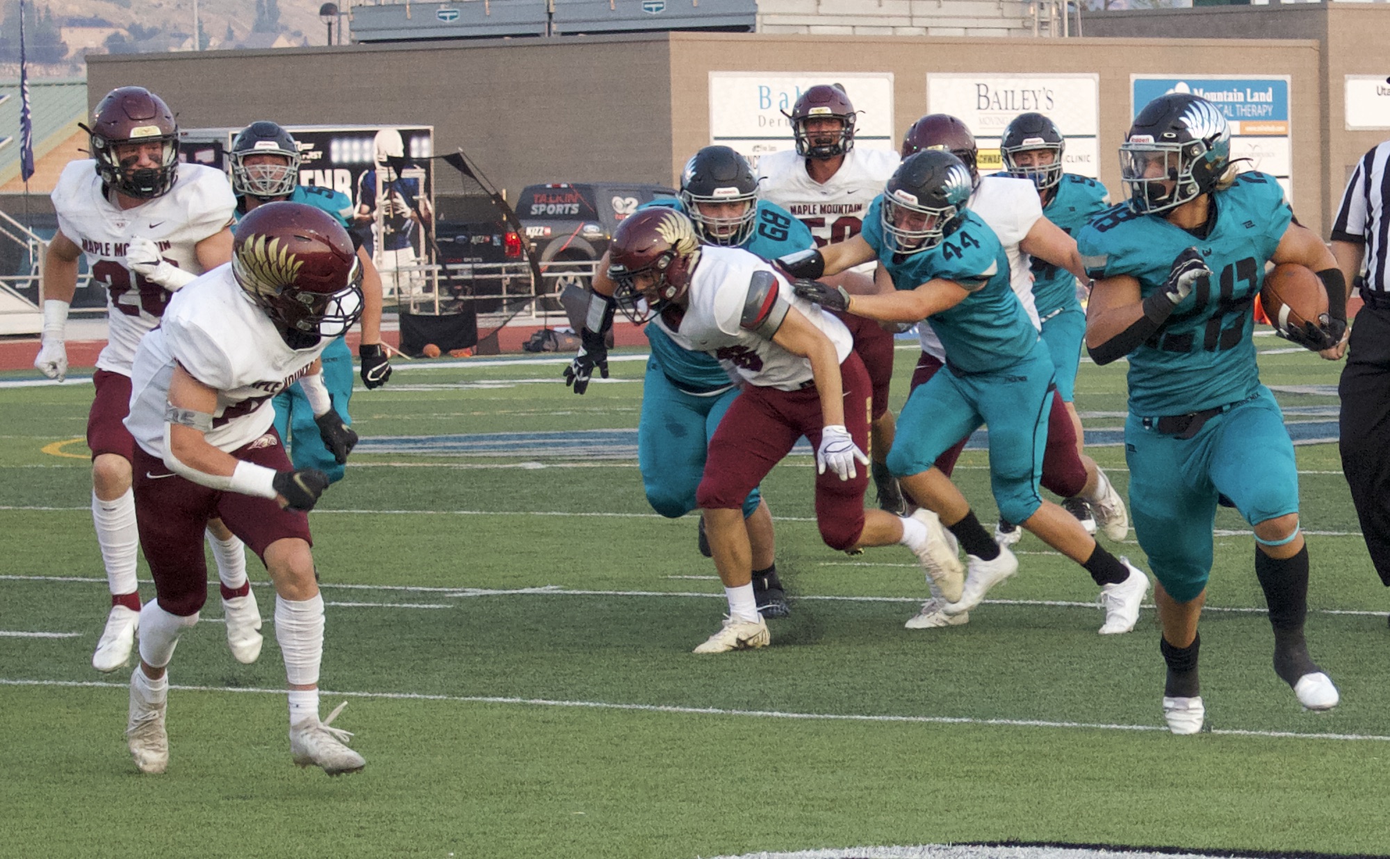 Farmington running back Boston Reinhold runs for yardage during a high school football game at Farmington High School, Thursday, Aug. 26, 2021 in Farmington.